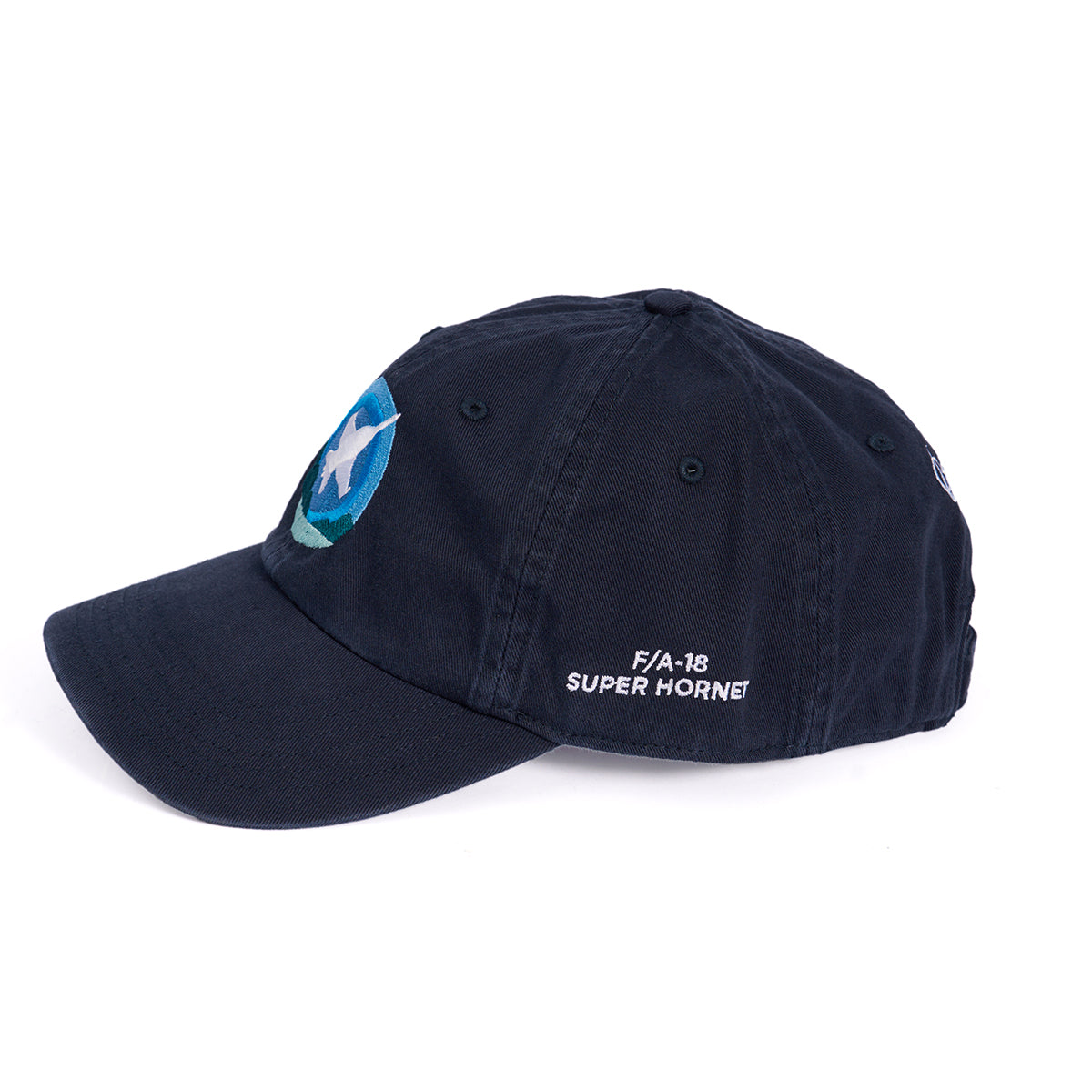 The Boeing F/A-18 Super Hornet Skyward Hat by Boeing features a navy blue design, a blue and white embroidered star logo on the front, white side stitching, and an adjustable backstrap, shown from the side against a white background.