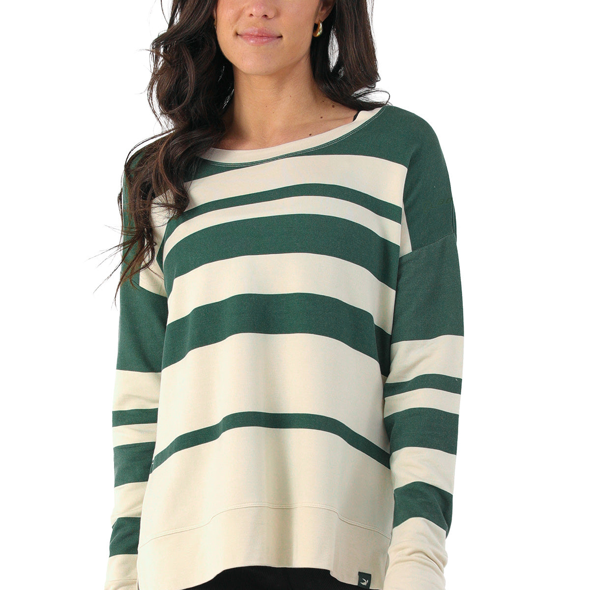A woman wearing a BOEING Glyder Boeing Women’s Lounge Long-Sleeve in cream with wide dark green stripes stands against a white background, showing only her upper body.