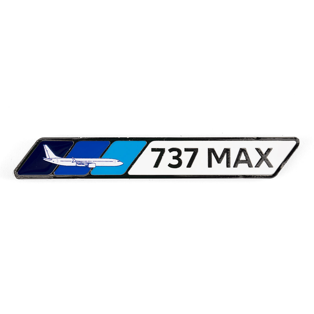 The Boeing 737 MAX Velocity Magnet is a nickel-plated, rectangular badge featuring an airplane illustration on the left. The text Boeing 737 MAX is elegantly set against a white background with adjacent blue and dark blue enamel geometric shapes.