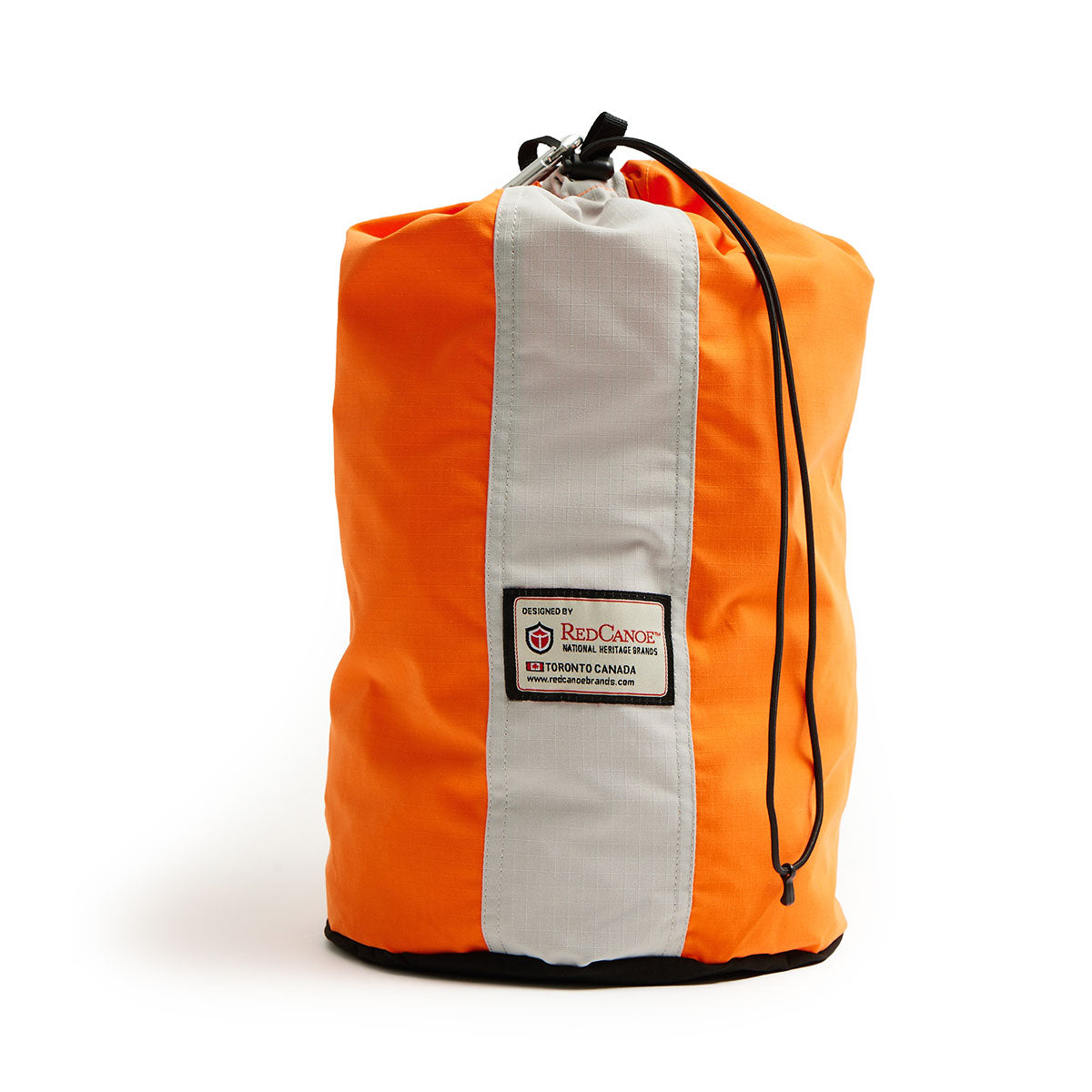 Bright orange duffel bag with a gray vertical stripe and black drawstring closure. Features a "Red Canoe" label, conveying adventure and durability.