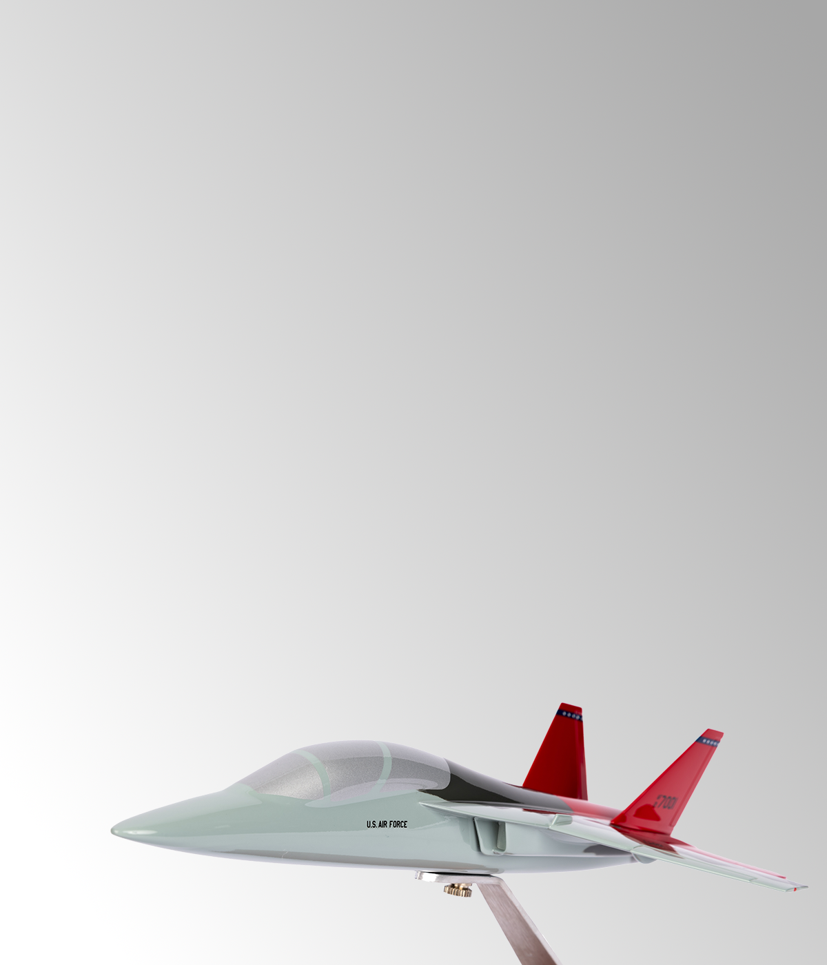 mobile banner featuring T-7A Redhawk miniature model airplane with red wings on grey background.