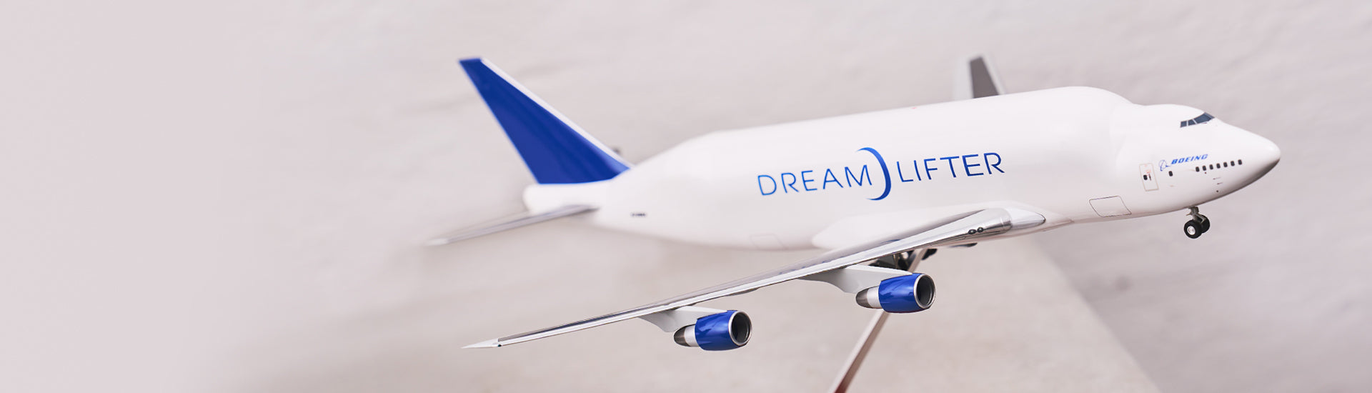 A detailed model of the Boeing Dreamlifter aircraft, showcasing its distinctive design and branding.
