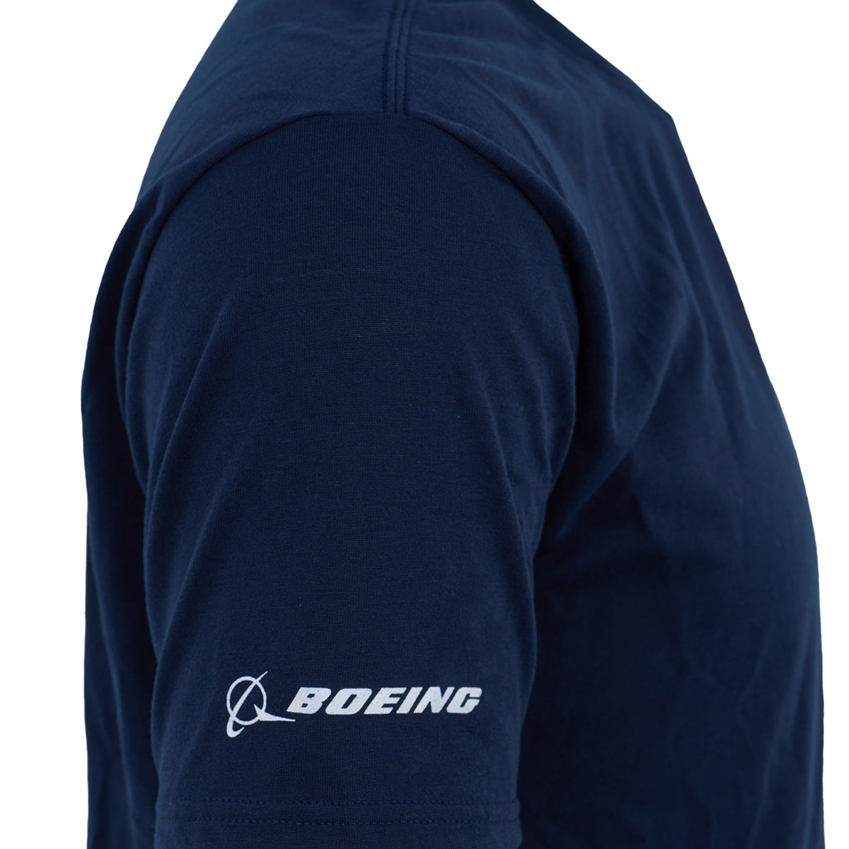 Close-up of a person wearing the Boeing F/A-18 Super Hornet Series Unisex T-Shirt in navy blue, featuring the BOEING logo in white on the left sleeve—a perfect pick for aviation fans.