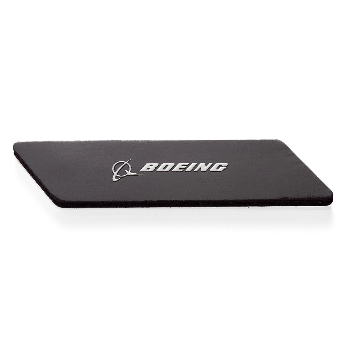 A rectangular black mat with beveled edges, features a sleek enamel design showcasing the Boeing logo and a 737 MAX emblem, called the Boeing 737 MAX Velocity Magnet by Boeing.