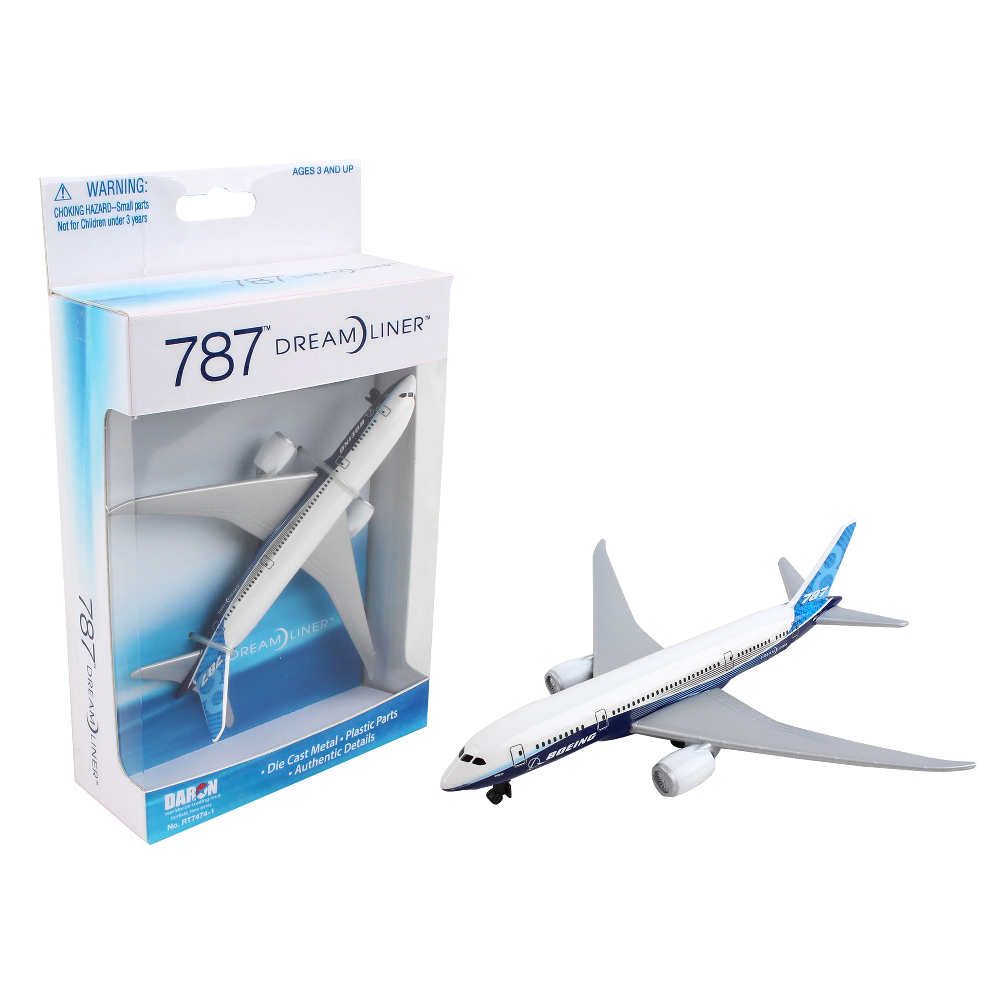 The Daron Boeing 787 Dreamliner Die-Cast Toy, featuring sleek white and blue colors, sits next to its transparent-sided box that displays the model along with branding and safety warnings, making it perfect for any aviation enthusiast.