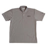 The Boeing Stores Starliner CST-100 Polo is a gray, moisture-wicking shirt with short sleeves, three buttons, UV protection, and features a CST-100 STARLINER logo on the left chest and a Boeing logo on the left sleeve.