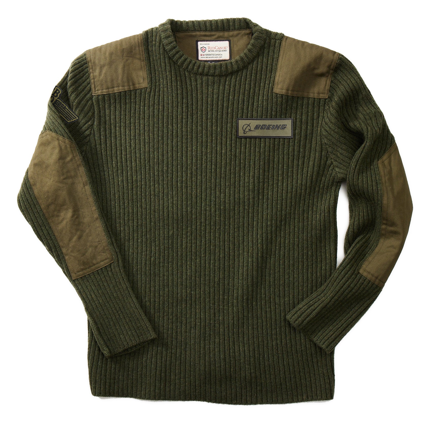 The Boeing Store’s Red Canoe Boeing Ribbed Crewneck Sweater features brown patches at the shoulders and elbows, a chest Boeing patch, a sleeve zip pocket, and is perfect for layering and warmth.