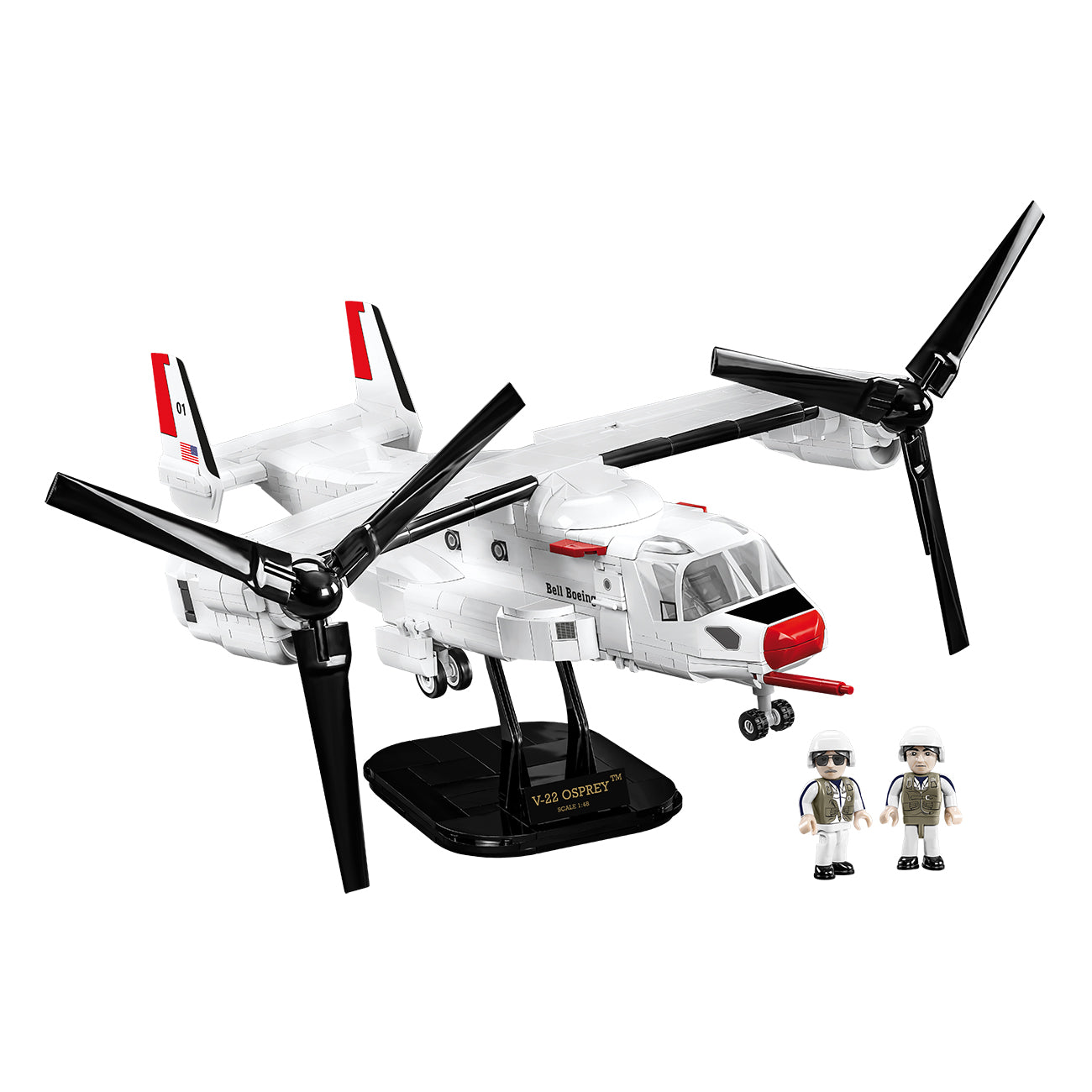The COBI Boeing V-22 Osprey Building Kit from The Boeing Store includes a white aircraft model with black and red accents, vertical tiltrotor propellers, a black stand, and two small pilot figures in uniform.