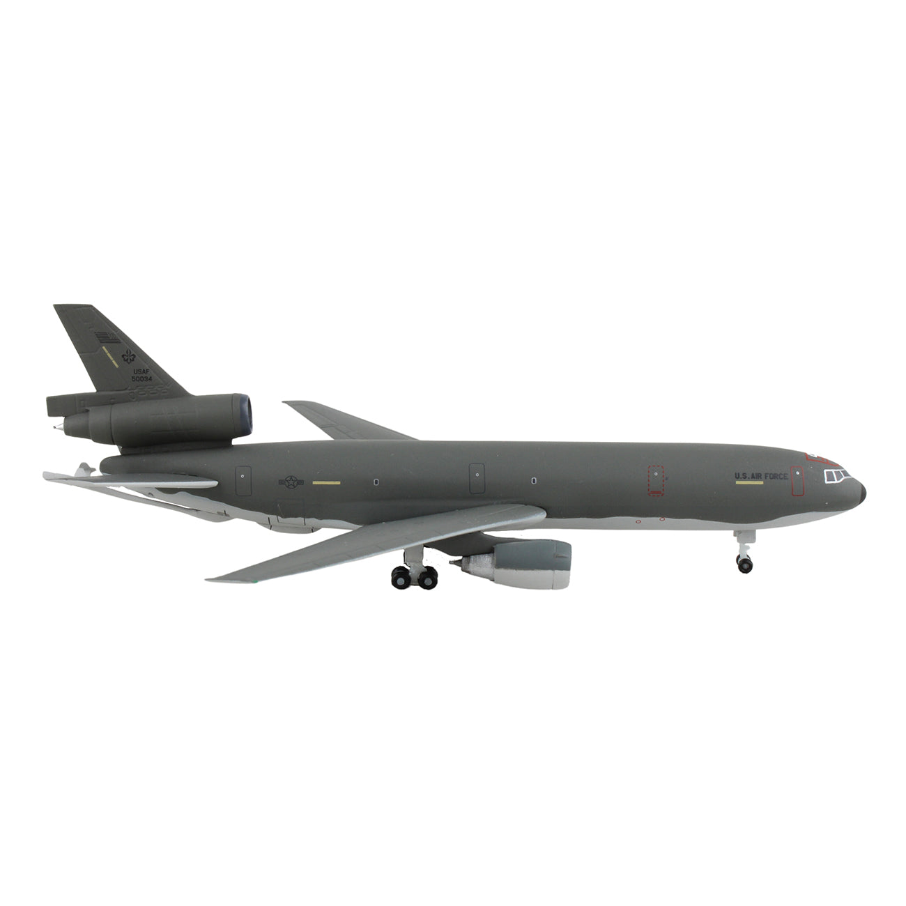The DARON Boeing KC-10A USAF 1:500 Model is a gray die-cast airplane with three engines and U.S. Air Force markings, shown in side view and flying with landing gear extended against a white background.