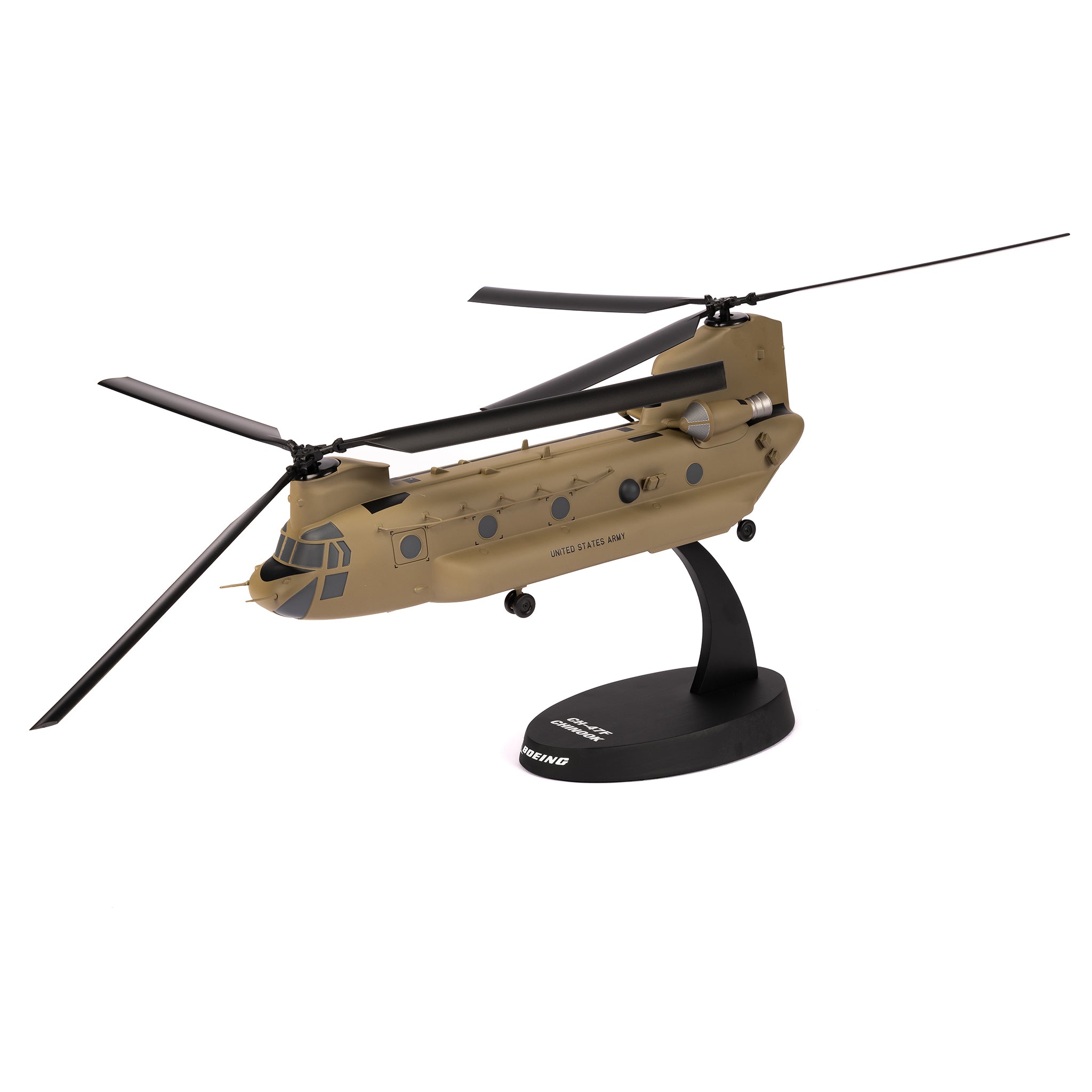 The Boeing Store’s Boeing U.S. Army CH-47F Model 1:40 is a tan helicopter replica with twin rotors, mounted on a black stand. Designed to resemble the military Chinook, it features detailed windows and sides.