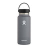 A stainless steel Hydroflask Boeing Water Bottle in gray features a black lid and handle. It has a wide mouth design, white logo, and Hydro Flask text near the bottom, standing elegantly against a plain white background. Available from The Boeing Store.