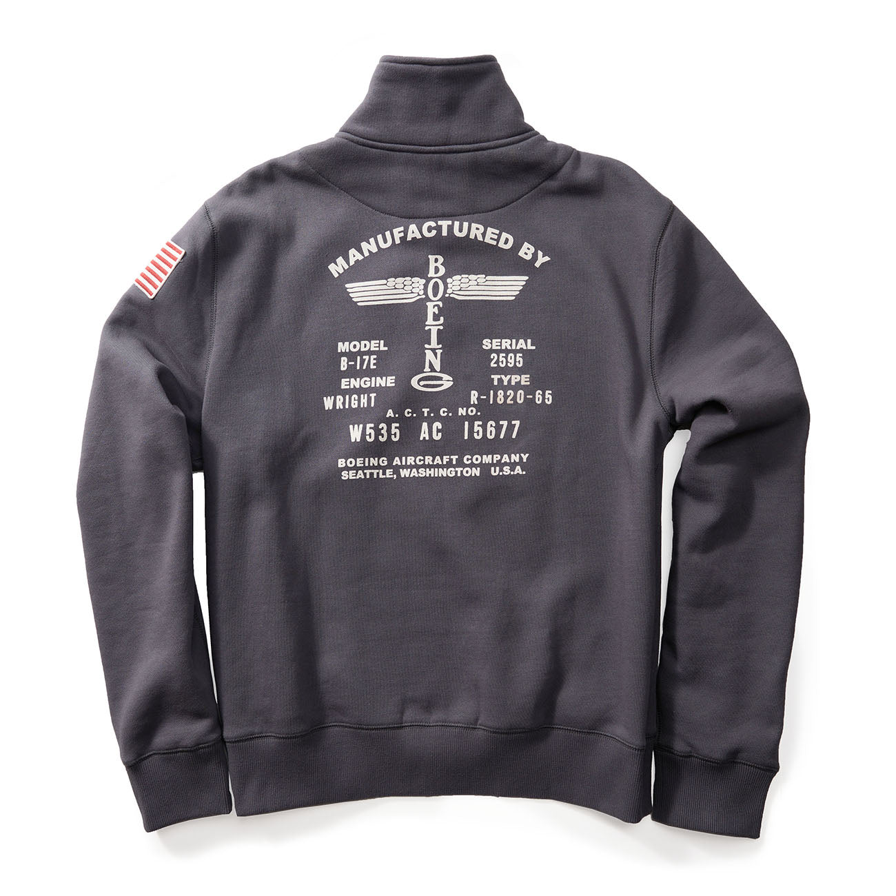 The Boeing Store Red Canoe full zip sweatshirt in dark gray includes a white text, American flag patch on the sleeve, and detailed B-17E aircraft engine info on the back. It mentions Manufactured by Boeing and Boeing Aircraft Company, Seattle, Washington USA. Made from soft cotton poly fleece.