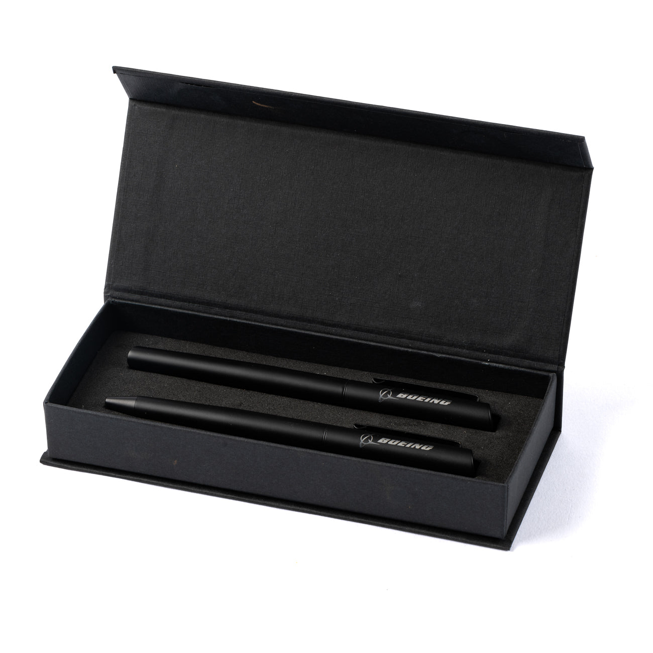 The Boeing Stores Boeing Angle Tip Pen Set features two black ink pens with Boeing branding, elegantly arranged side by side in a black gift box, displayed open on a white background.