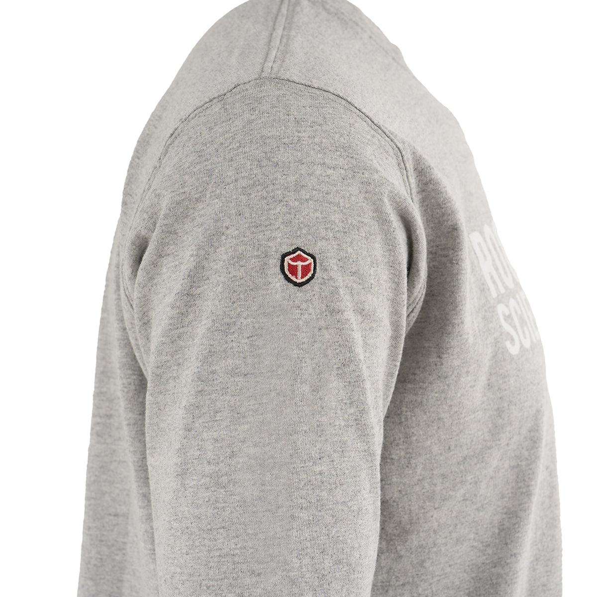 The Boeing Store’s Red Canoe NASA Long Sleeve T-Shirt, made from 100% cotton, is shown in light grey with a red and black shield logo on the upper sleeve and partial white chest text.