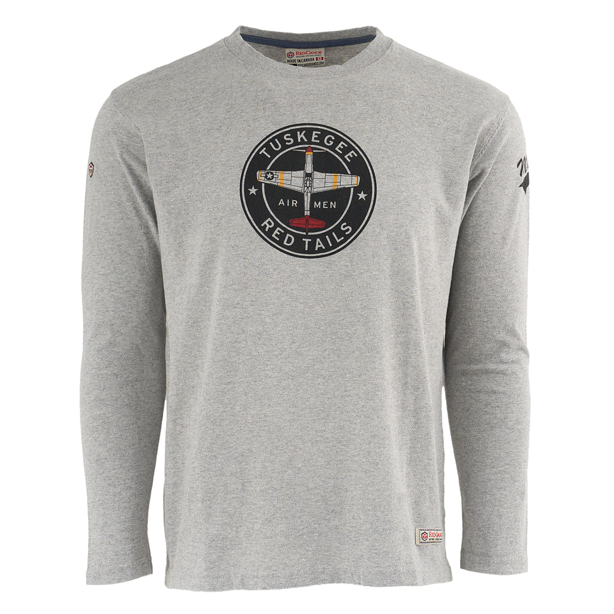 The Boeing Stores Red Canoe Boeing Tuskegee Airmen Long Sleeve T-Shirt is gray with a round chest emblem of the P-51 Red Tail Mustang and Tuskegee Airmen Red Tails, plus a hem patch and sleeve logo.