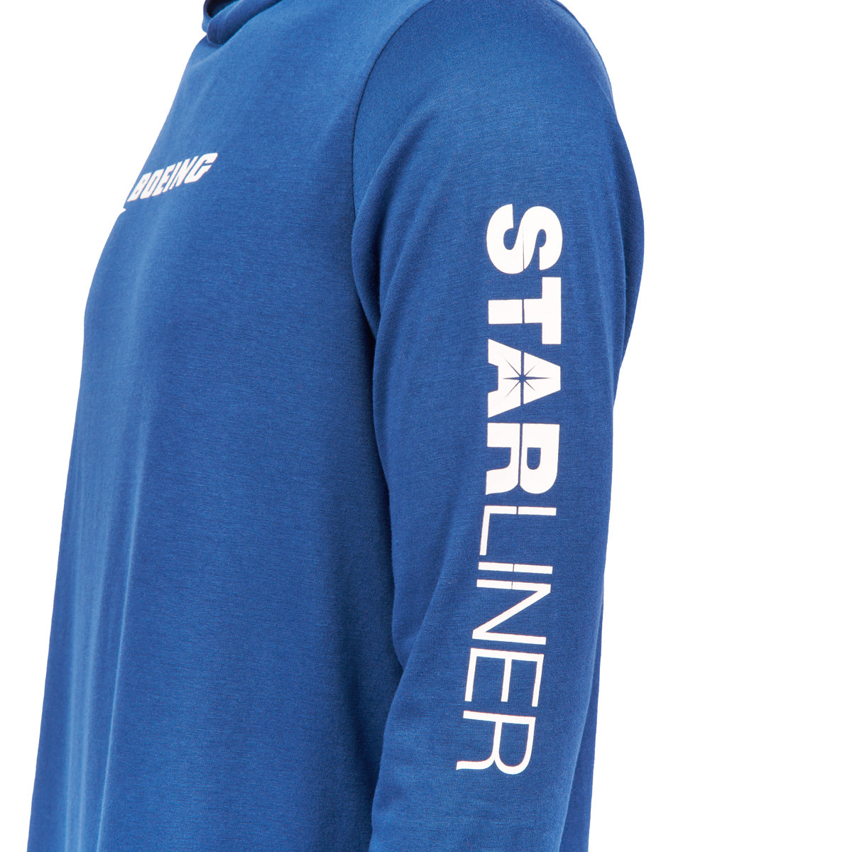 Wearing a Boeing CST-100 Starliner Unisex UPF Hoodie, the person sports Boeing on the chest. The sleeve features Starliner, set against a plain white background.