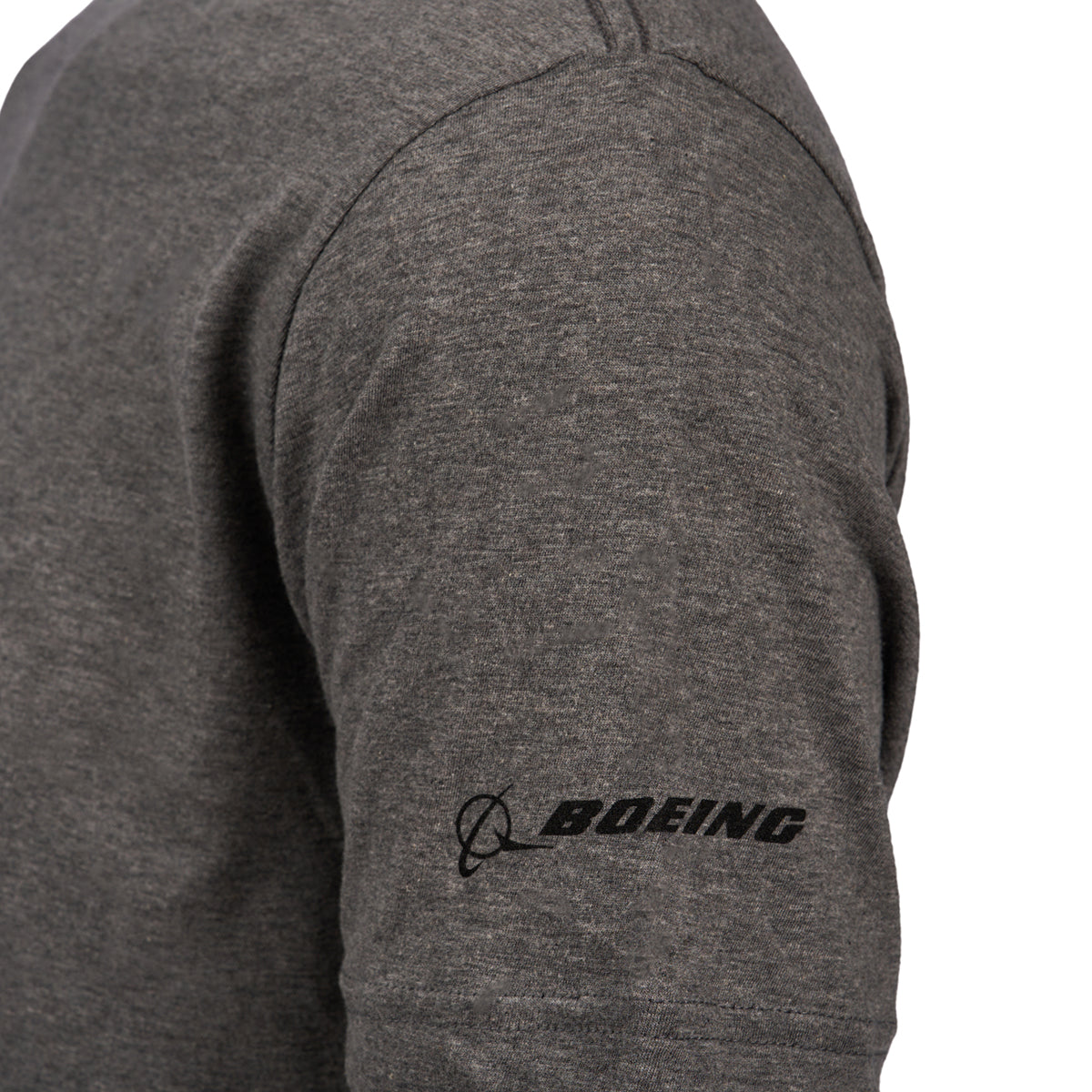 Close-up of someone in a Boeing Horizon Mens T-Shirt, showcasing the Boeing logo on the sleeve—ideal for aviation enthusiasts.
