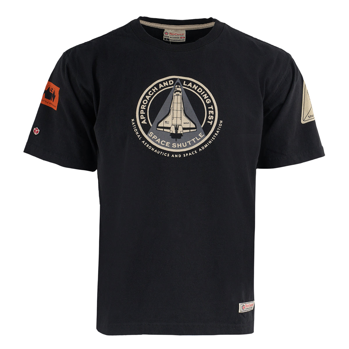The Boeing Red Canoe NASA ALT T-Shirt is a black tee with a large chest patch featuring a space shuttle and the phrases “Approach and Landing Test” and “Space Shuttle,” plus extra patches on both sleeves.