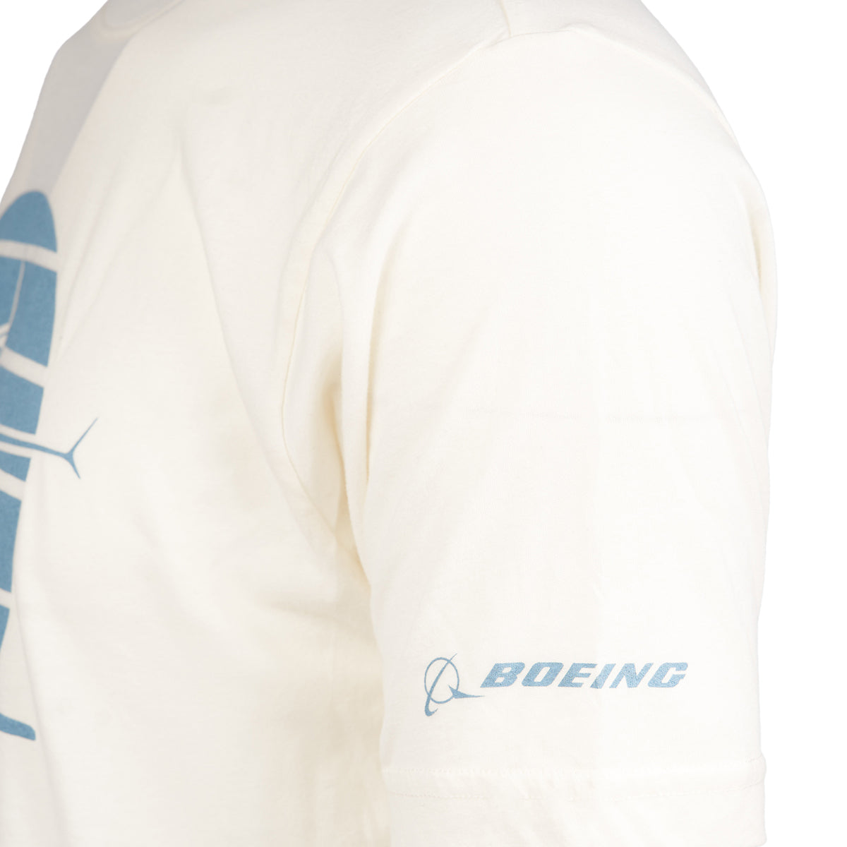 Close up of the Boeing logo on the left arm in light blue color on ivory color t-shirt