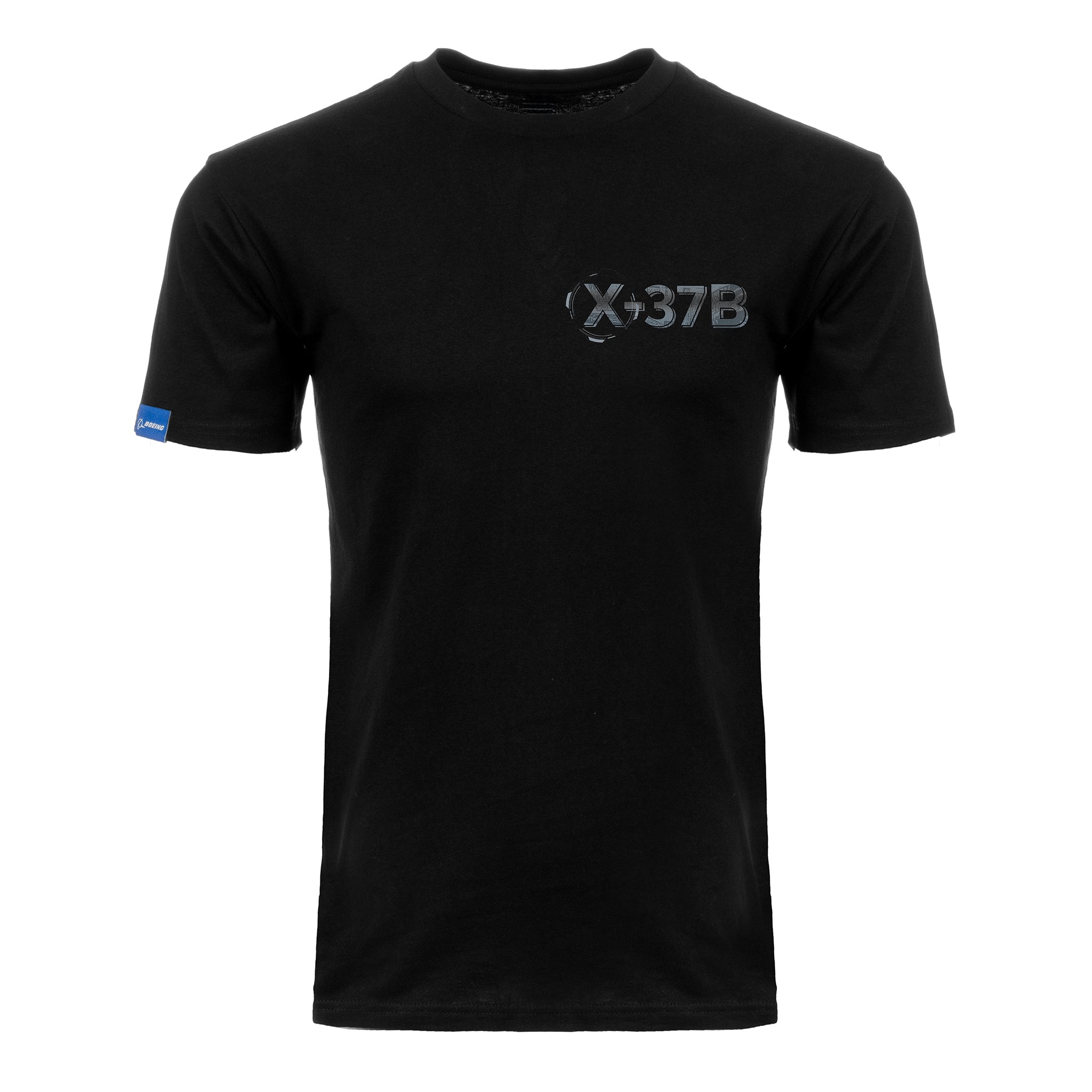 The BOEING X-37B Orbital Test Vehicle Unisex Graphic T-Shirt features a plain black, short-sleeve design with a gray circular graphic on the left chest and a small blue tag on the left sleeve—ideal for spaceflight apparel fans.