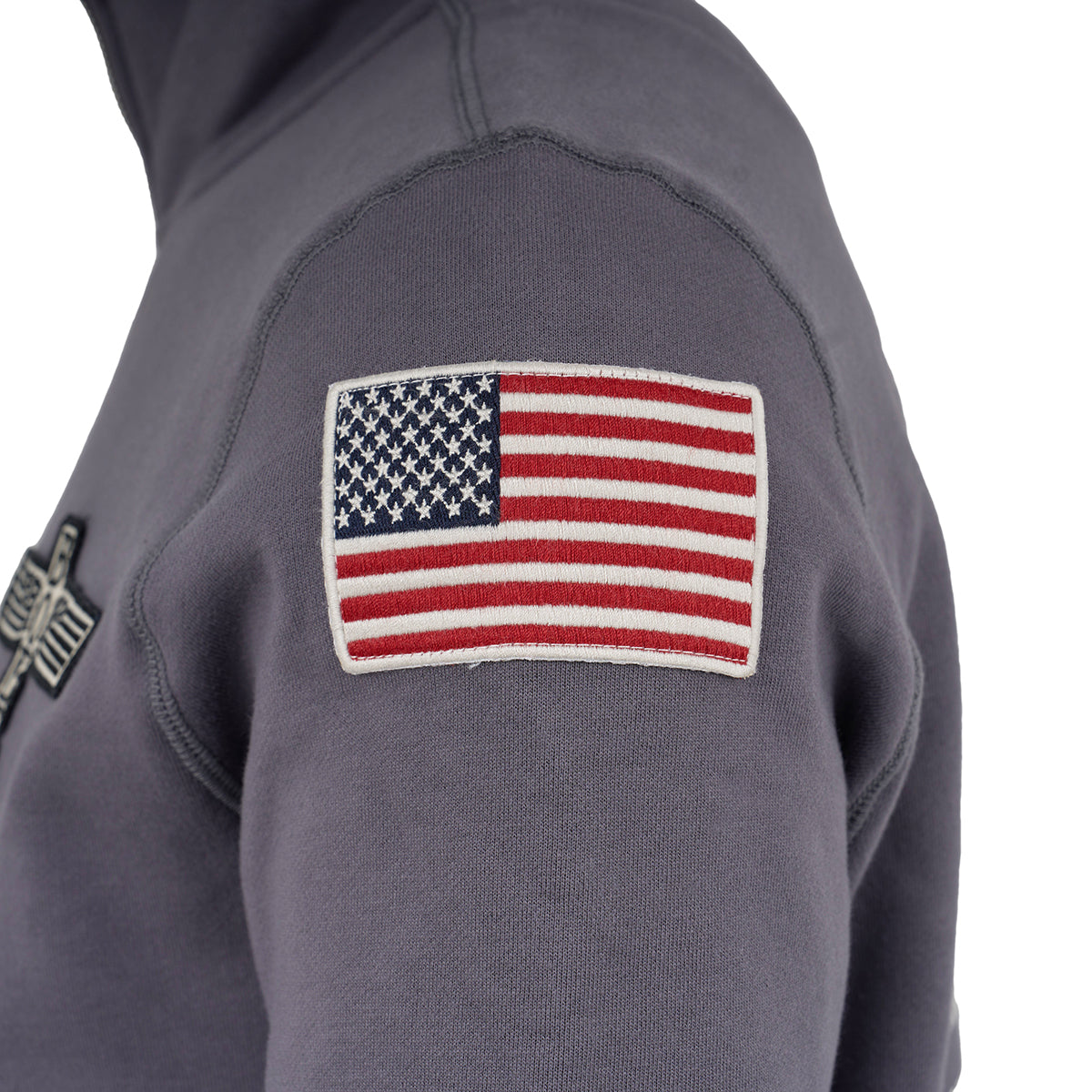 A close-up of The Boeing Store’s Red Canoe Boeing Airplane Logo Full Zip Sweatshirt in gray cotton poly fleece highlights the upper sleeve patch and part of the chest, with minimal background visible.