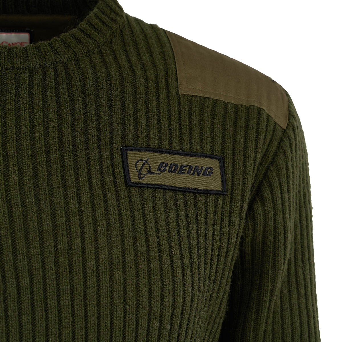 A close-up of The Boeing Store's Red Canoe Boeing Ribbed Crewneck Sweater, featuring a shoulder patch and rectangular Boeing logo on the chest, highlights the modern fit of this ribbed acrylic wool sweater.