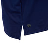 Close up image of the Greyson logo on bottom right hip area on blue polo.