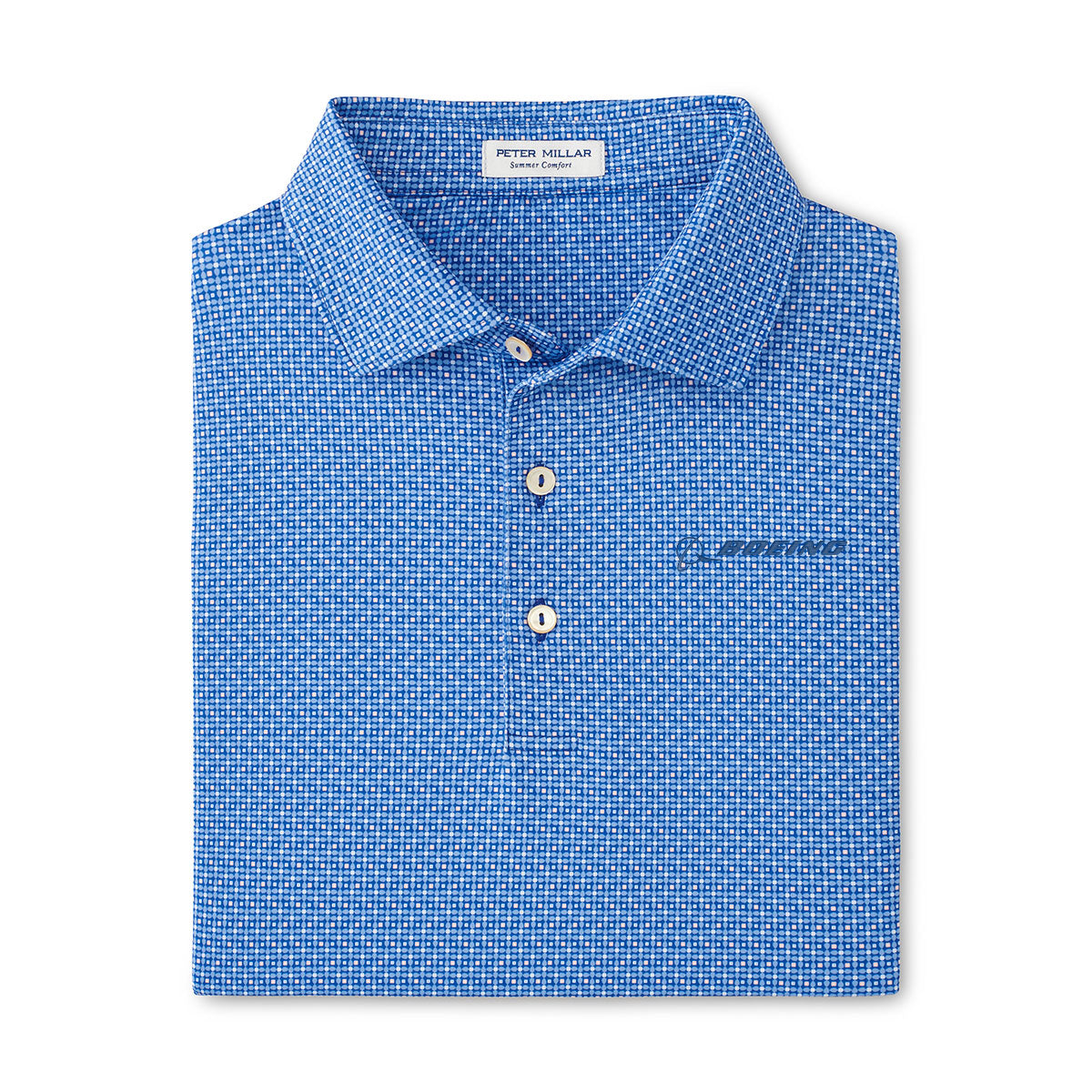 Folded blue Peter Millar Boeing Men’s Vega Performance Polo featuring a small white check pattern, pointed collar, three white buttons, 4-way stretch fabric, and an interior tag reading Peter Millar. Brand: BOEING.