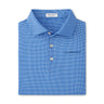 Folded blue Peter Millar Boeing Men’s Vega Performance Polo featuring a small white check pattern, pointed collar, three white buttons, 4-way stretch fabric, and an interior tag reading Peter Millar. Brand: BOEING.