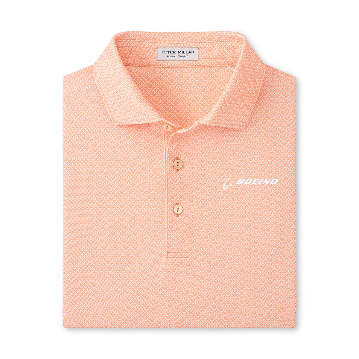 The Peter Millar Boeing Men’s Santos Geo Performance Polo is a peach polo with a subtle geo pattern, UPF 50+ protection, and features the white Boeing logo on the chest and a Peter Millar collar tag.