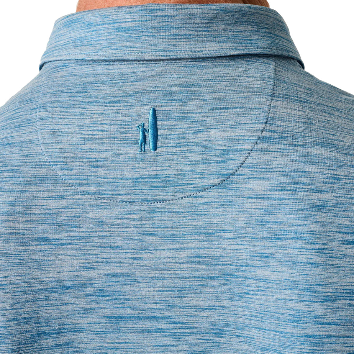 Close-up of the back of the johnnie-O Boeing Men’s Huronn Featherweight Performance Polo by BOEING, in light blue with a small embroidered figure and surfboard below the collar. Four-way stretch ensures comfort and easy movement.