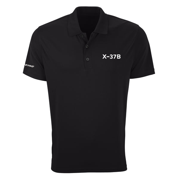 The Boeing X-37B Men's Performance Polo is a black shirt featuring "X-37B" in white on the left chest and "BOEING" in small white text on the left sleeve.
