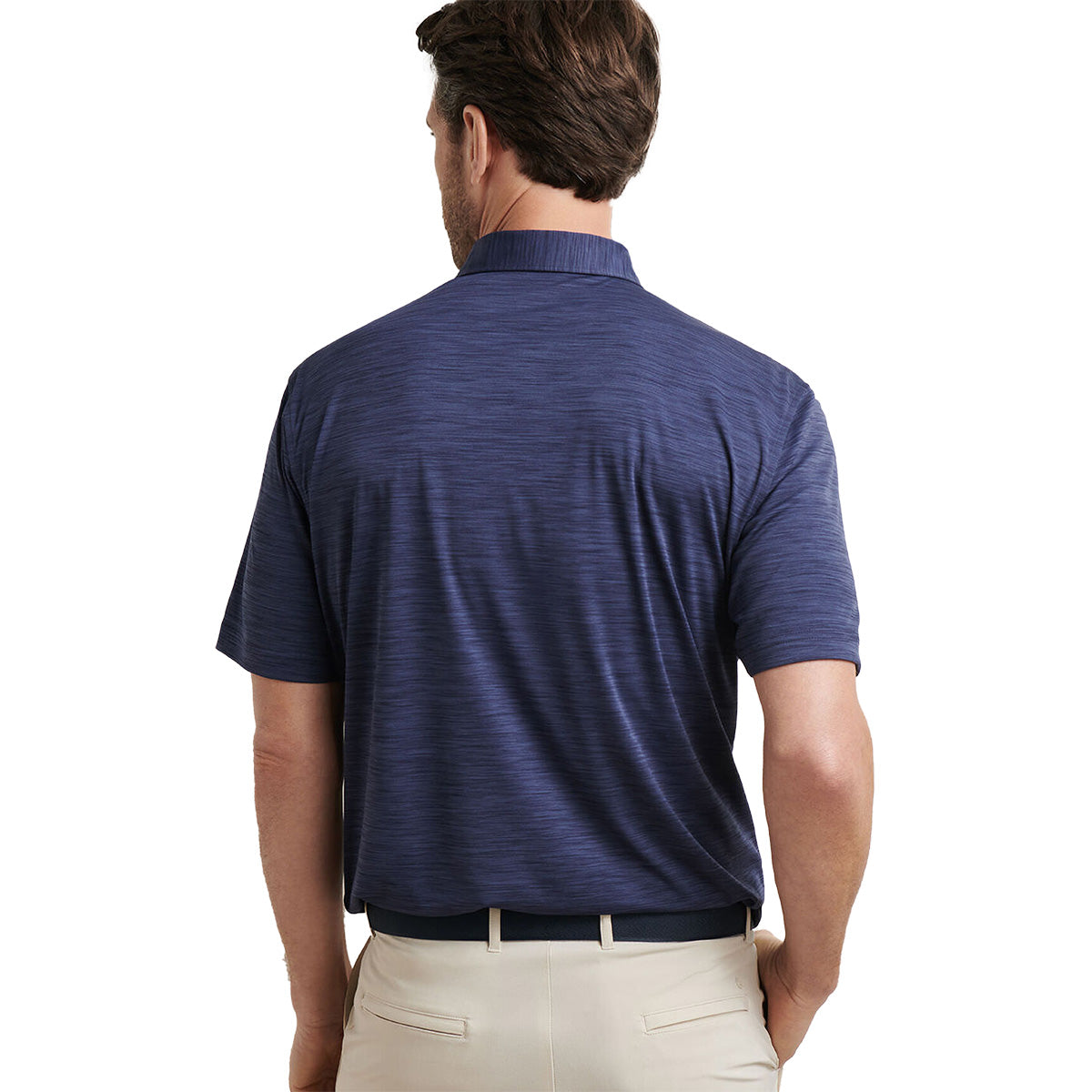 A man with short brown hair is seen from behind wearing a navy Peter Millar Boeng Men’s Featherweight Mélange Polo by BOEING, light beige pants, and a dark belt, standing against a plain white background.