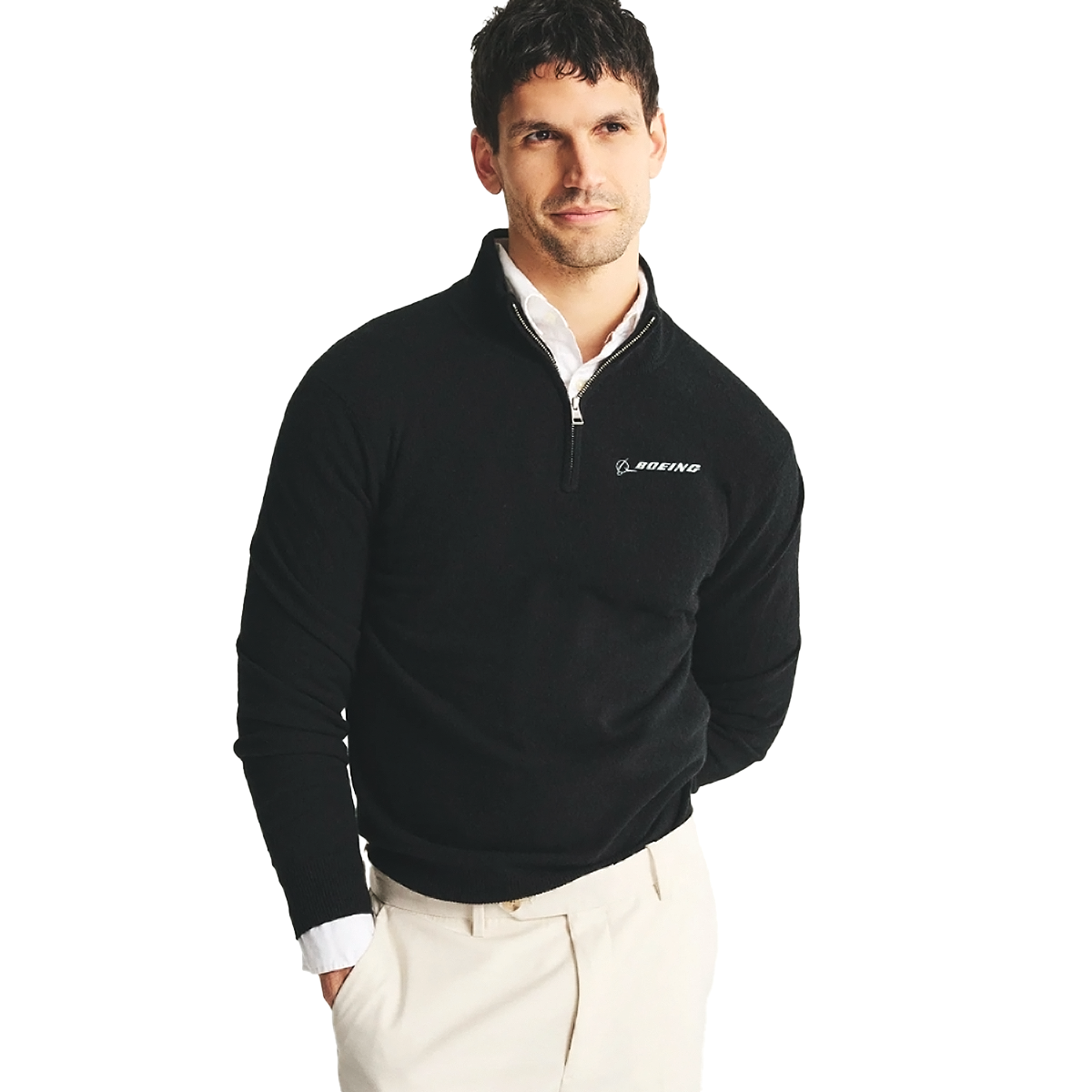 A man stands against a white background, one hand in his pocket, wearing the BOEING Signature Men’s Cashmere Quarter-Zip pullover over a white collared shirt, with the Boeing logo visible, looking forward.