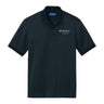 Introducing the Boeing Spirit Defense Men’s Polo by BOEING—a black, short-sleeve performance shirt featuring a collared neckline and button placket. The left chest displays the white Spirit, a Boeing Company logo, symbolizing Boeing Spirit Defense. Engineered with moisture-wicking fabric, this polo offers a simple yet professional design ideal for everyday wear.