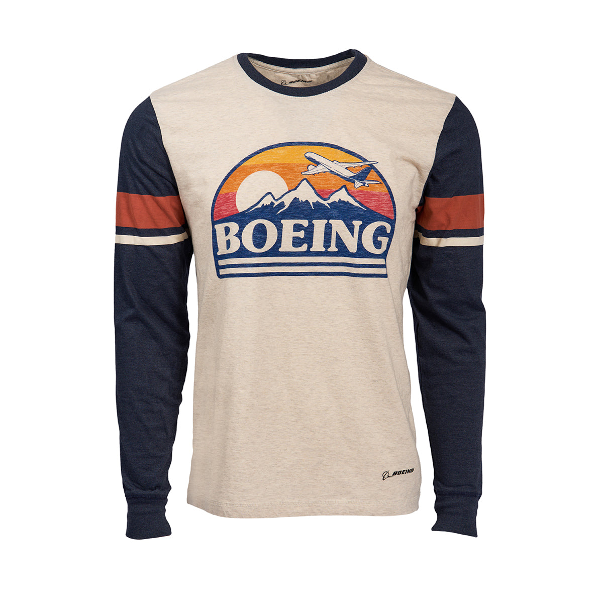 The Boeing Horizon Mens Long Sleeve T-Shirt by Boeing features a vintage design with a light body and dark, striped sleeves. It showcases an aviation graphic with mountains, a plane, and Boeing Horizon set against an orange and purple sunset.