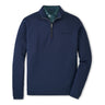 The Peter Millar Boeing Men’s Albatross Quarter-Zip is a navy blue midlayer with long sleeves, moisture-wicking fabric, a striped inner collar, and a subtle Boeing logo on the left chest.