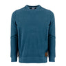 The Boeing Symbol Patch Unisex Crewneck Sweatshirt by Boeing is a long-sleeve, blue sweatshirt made from premium loungewear performance fabric. It features a crewneck design and is accented with a small brown Boeing symbol patch near the bottom hem, shown against a plain white background.