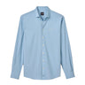 The johnnie-O Boeing Men’s Travis Performance Button Down Shirt by BOEING is light blue with long sleeves, a collar, white buttons, moisture-wicking fabric, and an embroidered logo on the left chest, shown on a plain white background.