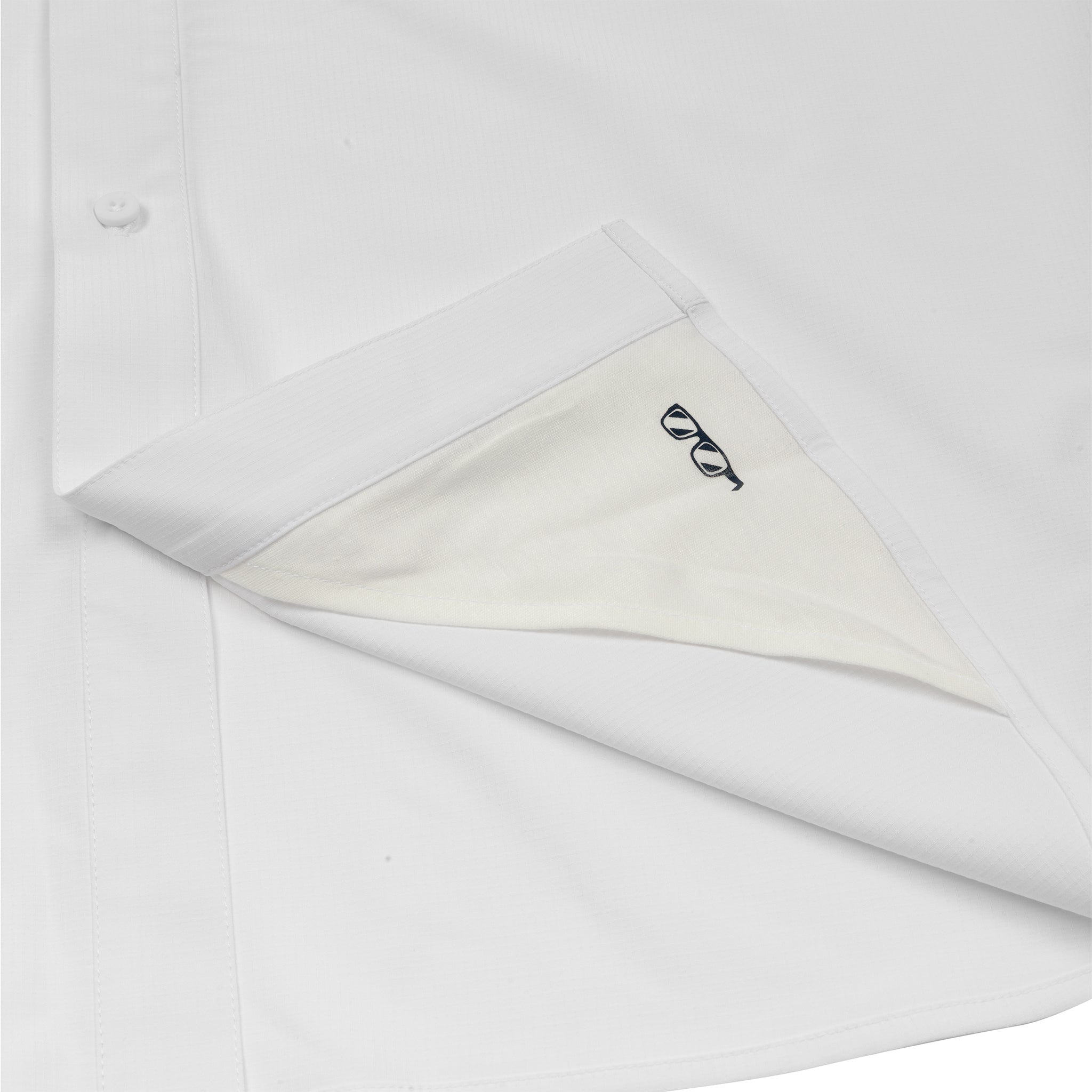 A close-up of the Boeing Signature Logo Men's Long Sleeve Utility Shirt in white shows the bottom corner lifted to reveal a small embroidered DNA double helix inside the hem. This BOEING shirt is quick-dry, stylish, and practical.