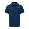 Introducing the BOEING Signature Logo Men’s Short Sleeve Utility Shirt in navy blue, featuring two chest pockets and a white Boeing logo on the left chest. Crafted with quick-dry technology and UPF 50+ protection, this shirt offers both comfort and functionality. Displayed against a plain white background.