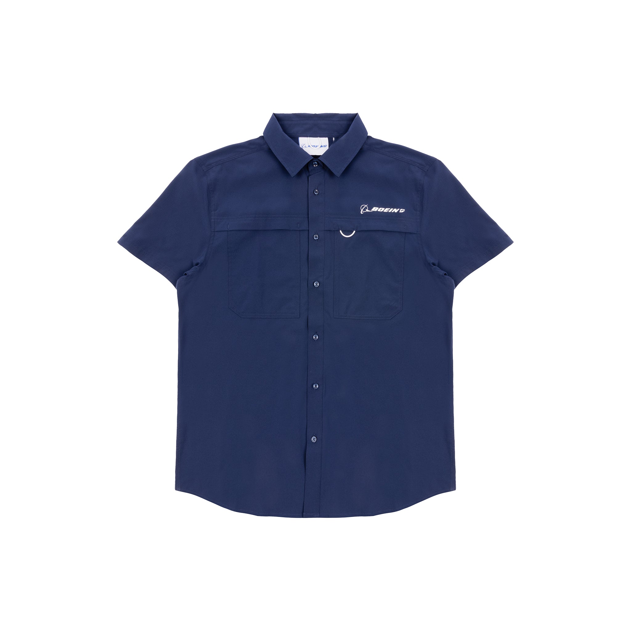 The Boeing Men's Short Sleeve Utility Shirt by BOEING features navy blue fabric, UPF 50+ protection, short sleeves, two chest pockets, and an embroidered Boeing logo on the left chest. Shirt shown laid flat on a white background.