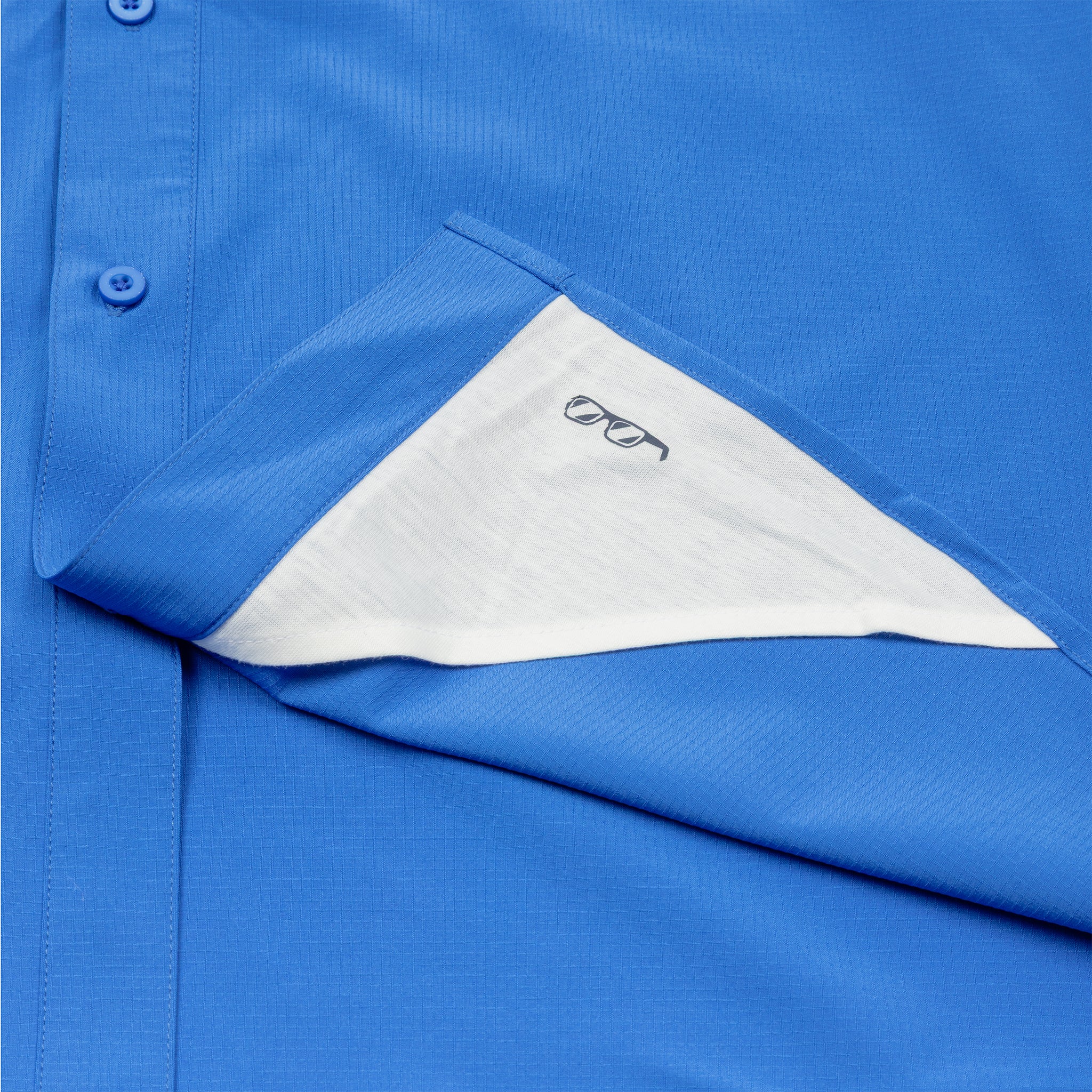 The Boeing Signature Logo Men's Short Sleeve Utility Shirt by BOEING features a blue design, white inner pocket lining with an eyeglasses illustration, and offers stylish utility plus UPF 50+ sun protection.