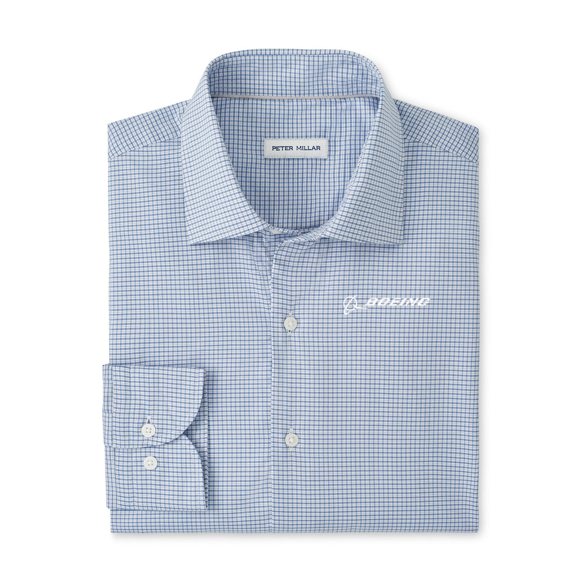 The Peter Millar Boeing Men’s Conway Sport Button-Up Shirt features a light blue and white check pattern, stretch cotton fabric, moisture-wicking comfort, a visible inside collar label, and the Boeing logo embroidered in white on the chest.