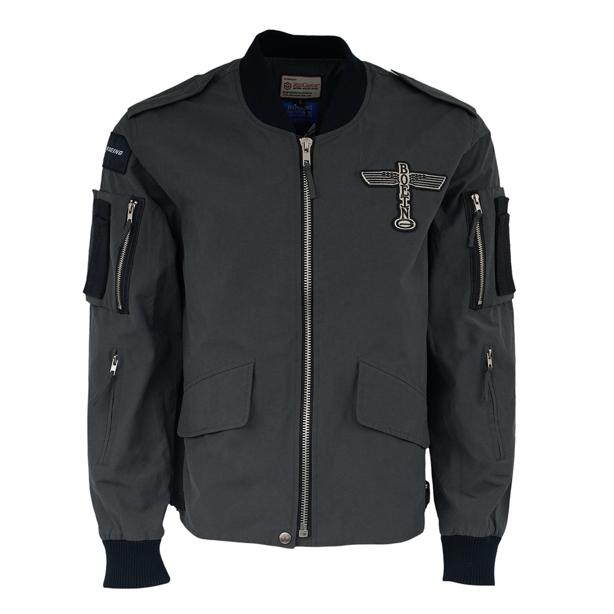 The Red Canoe Boeing Flight Jacket from The Boeing Store features a modern fit in black, zippered pockets, ribbed cuffs and waist, and a winged Boeing patch on the left chest. Displayed on a plain white background.