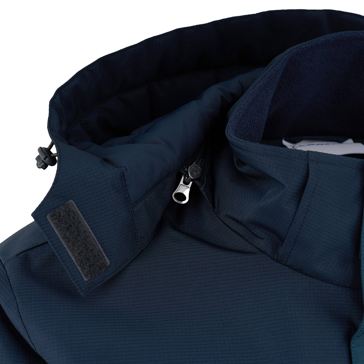 Close-up of the BOEING Men's Trifecta Ripstop Jacket in navy blue, featuring a raised water-resistant collar lined with dark fleece, black Velcro strap, and partially open zipper.