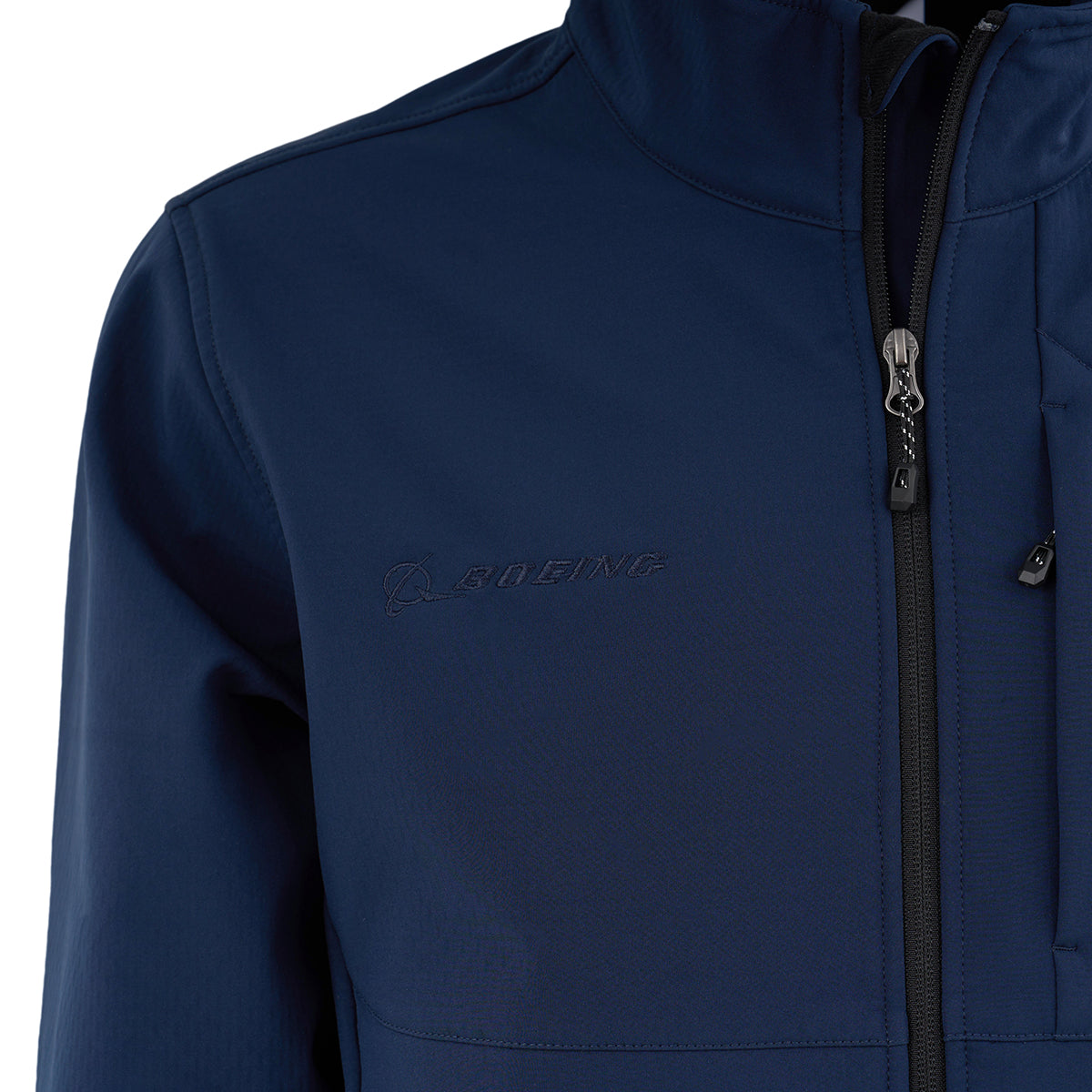 Close-up of the Boeing Men's Softshell Jacket by BOEING in navy blue, showing a vertical zipper and embroidered logo on the left chest. This water-resistant jacket accentuates the upper torso and shoulder area.
