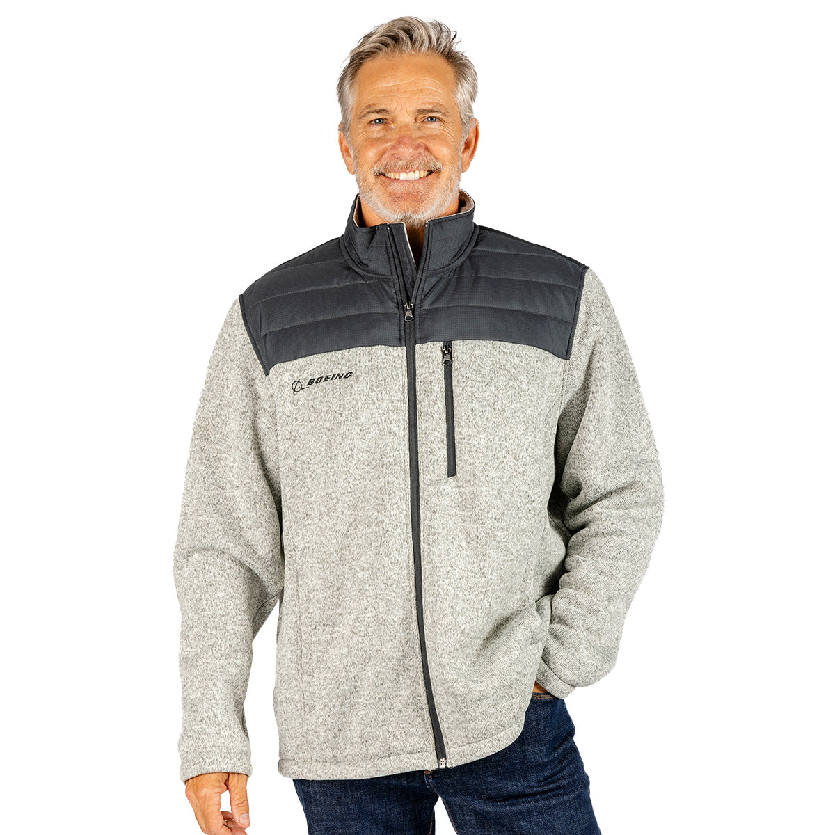 Man wearing a gray Boeing Unisex Full-Zip Mountain Fleece with a dark gray quilted yoke and a zippered chest pocket.