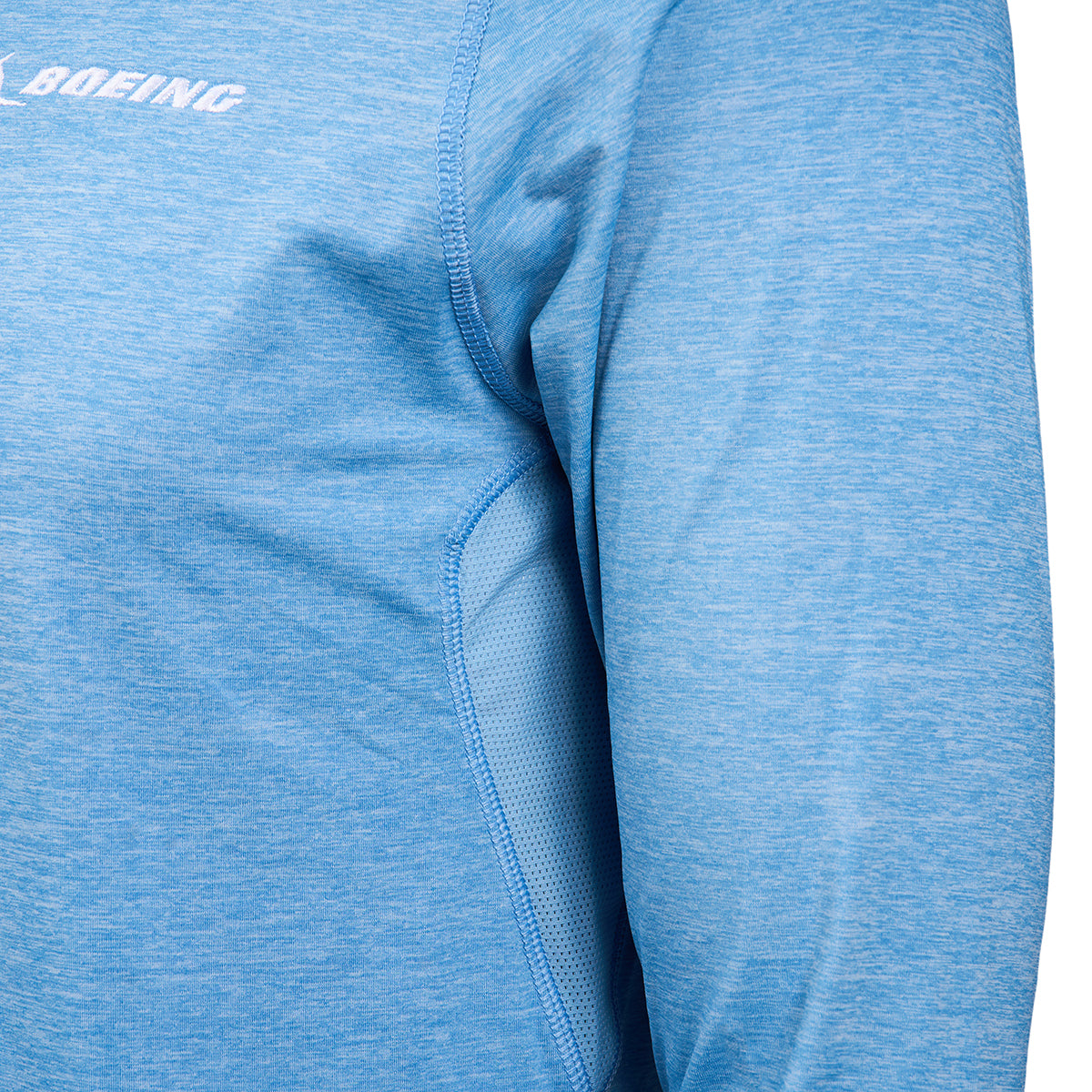 Close-up of a person wearing the Greyson Boeing Men’s Guide Sport Quarter-Zip, featuring BOEING in white on the upper left chest. Only part of the upper body and one arm are visible.