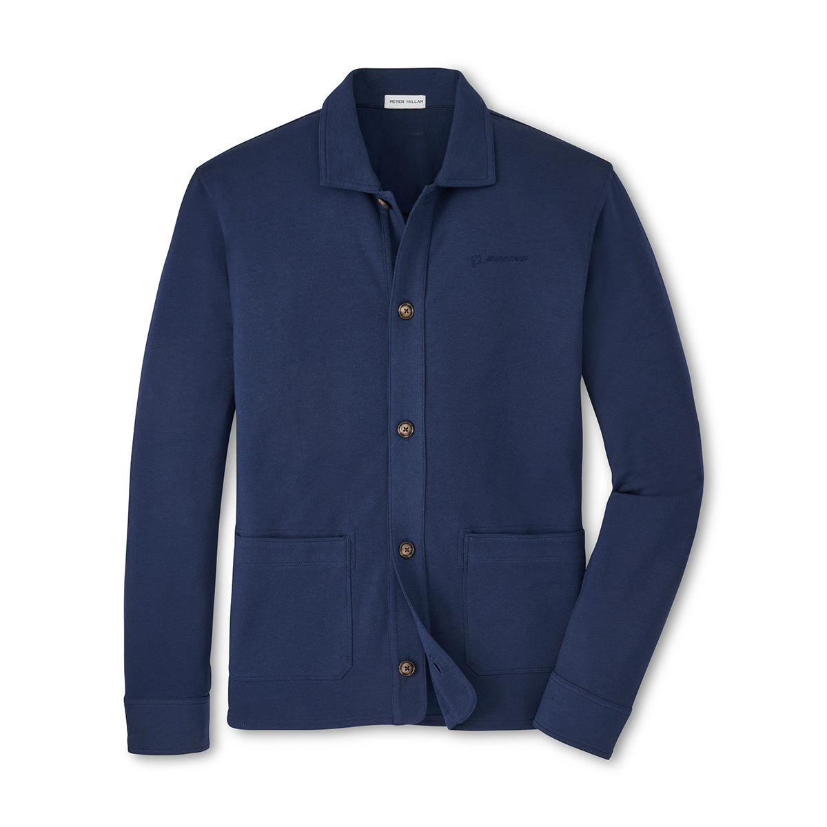 The Peter Millar Boeing Men’s Oasis Chore Coat by BOEING is a navy blue button-up with a collar, two front pockets, left chest logo embroidery, and soft Oasis fabric, shown laid flat on a white background.